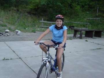 Kiah riding her bike in the mountains
